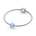Sterling silver charm with light blue lab-created opal