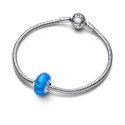 Sterling silver charm with deep blue lab-created opal